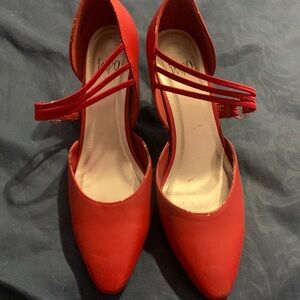 It is a dark red that are two inch maybe three inch heels